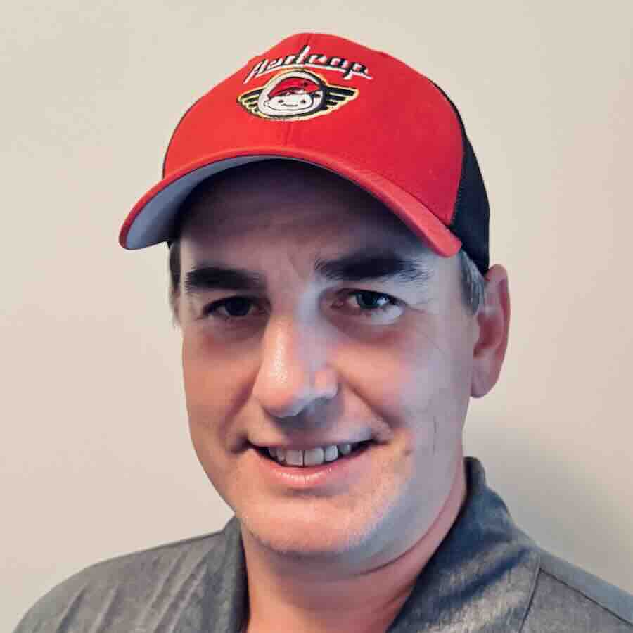Redcap founder and owner, Jeff Tillapaugh, wearing a red baseball cap.