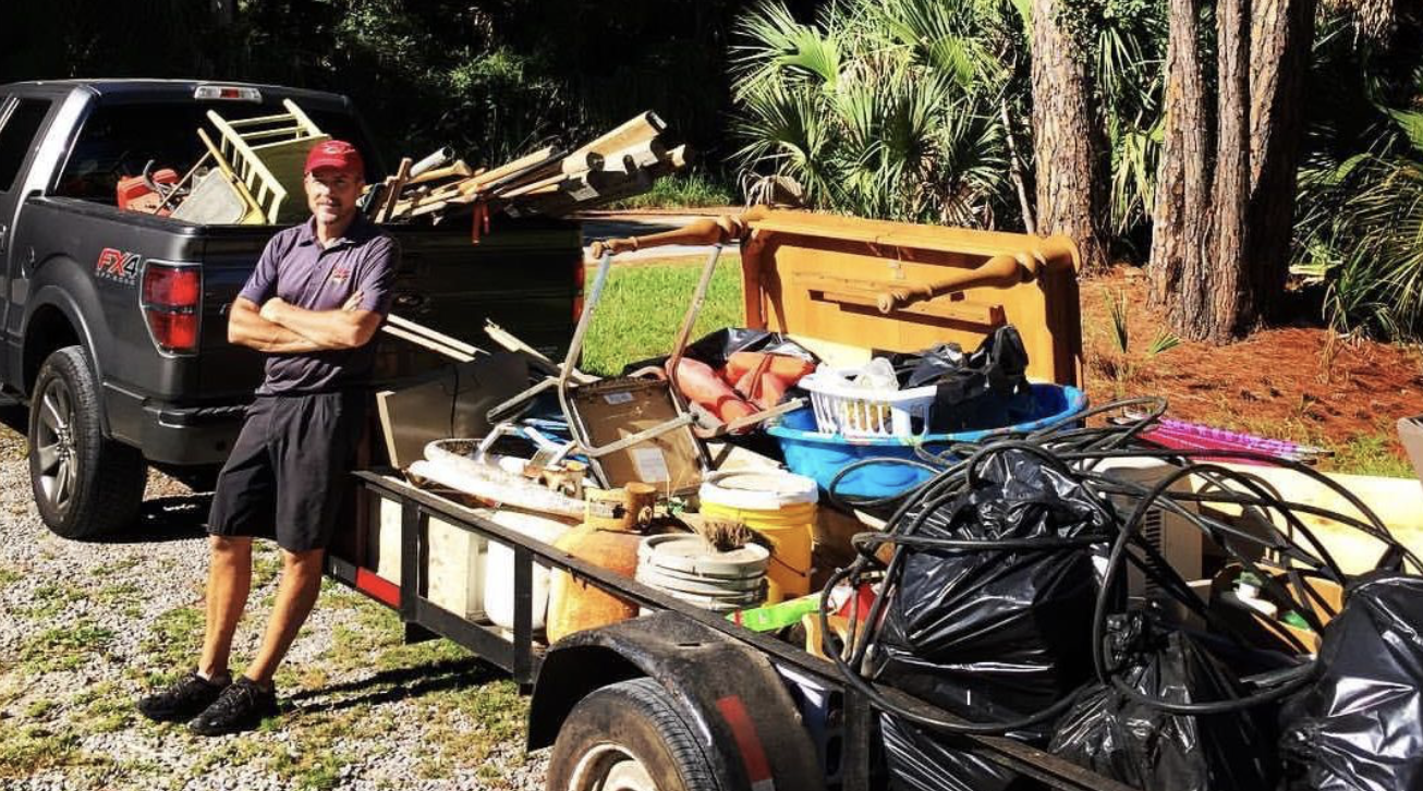 Man with truck loaded for trash cleanup