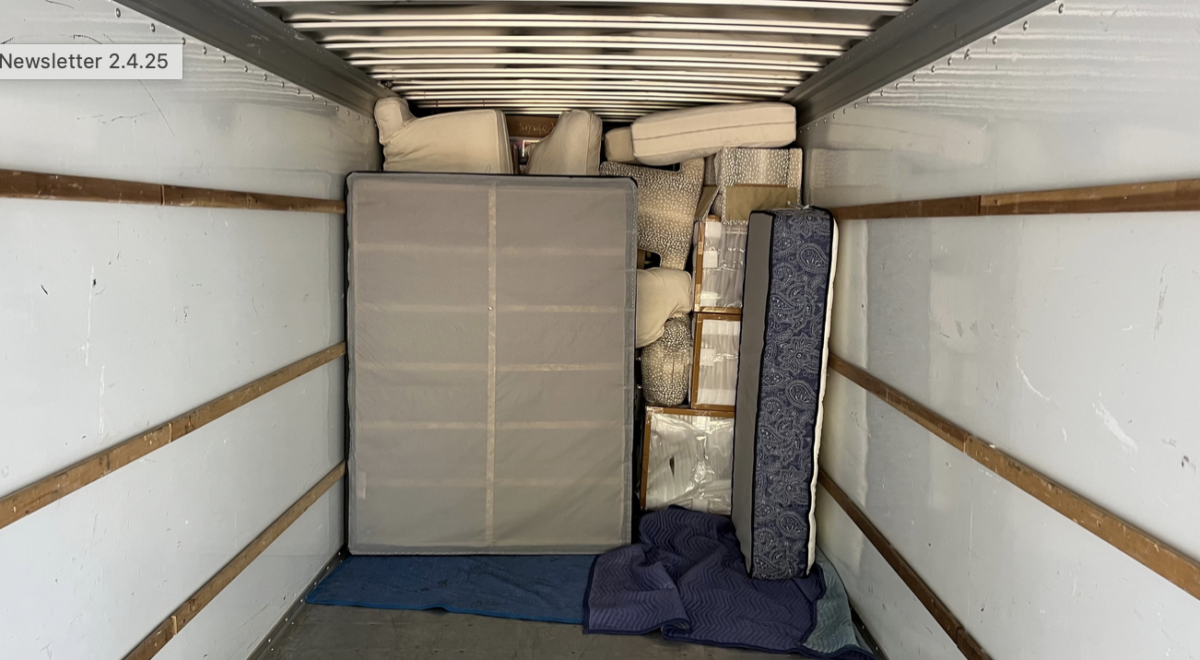 Inside view of loaded moving truck with furniture.