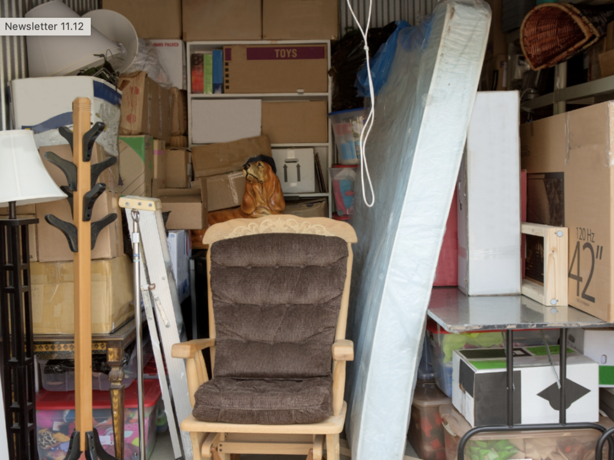 Storage unit filled with various boxes and furniture.