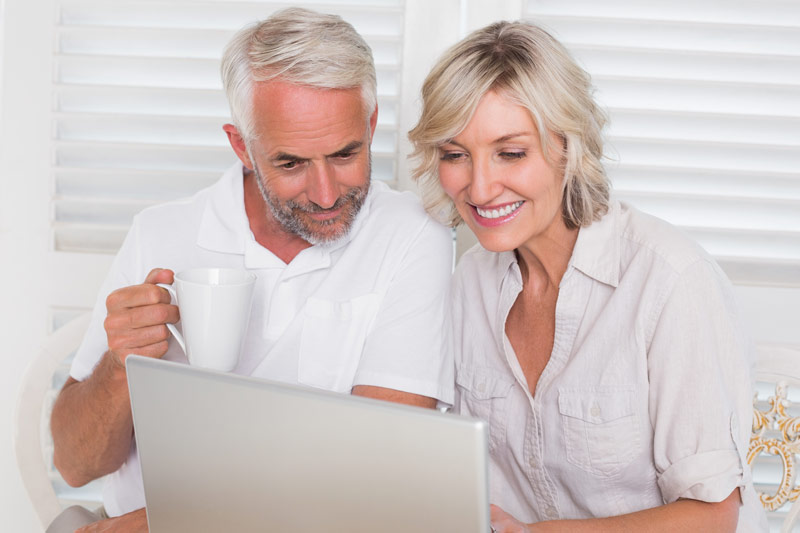 Older couple using laptop at home